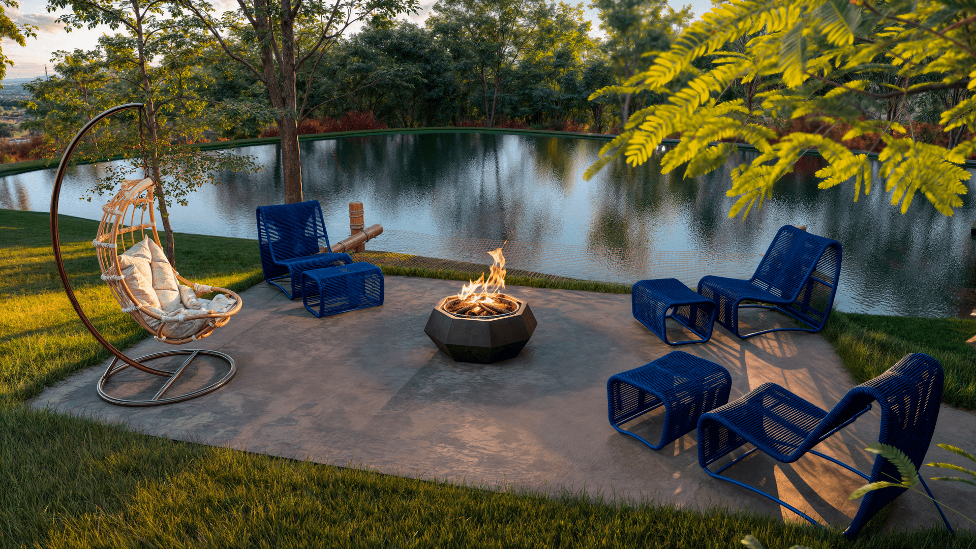 Outdoor seating area with blue chairs and a fire pit near a tranquil pond surrounded by greenery.