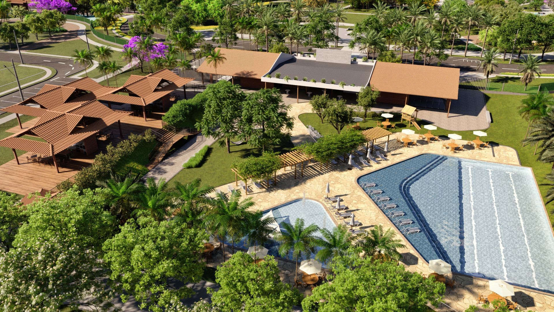 Aerial view of a resort with multiple pools, shaded seating areas, and lush greenery.