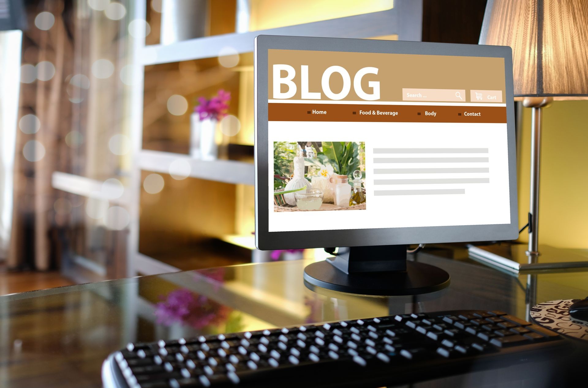 Blog Social Media Information connect Concept. Blogging on a desktop computer screen with keyboards and other accessories on the desk in a warm lightroom.